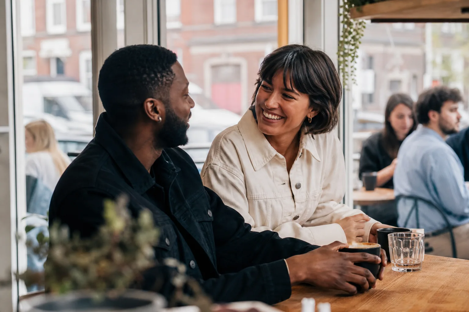 People meeting outside cafés in Birmingham city centre