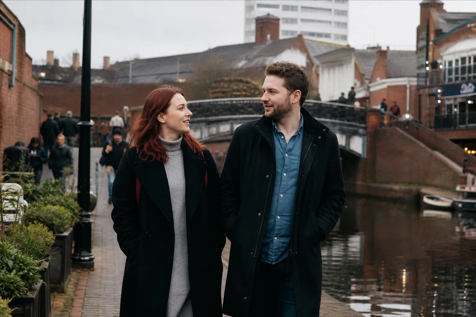Two people chatting over drinks at a relaxed Birmingham bar