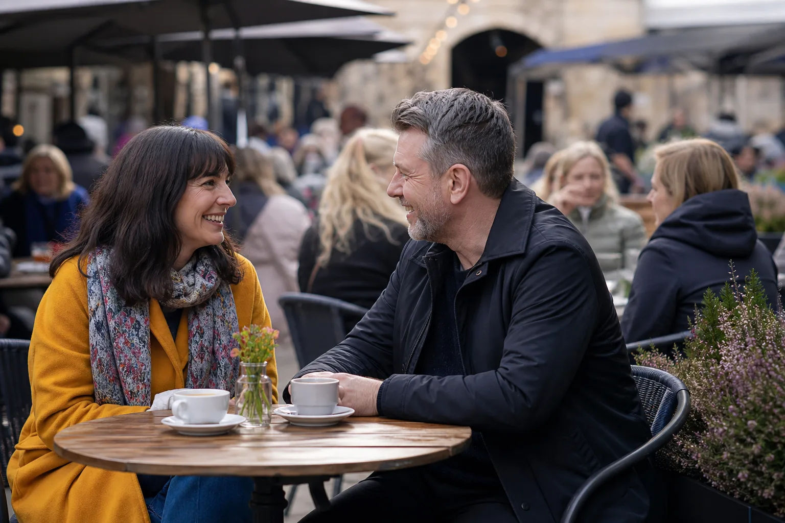 Two people talking over coffee on a relaxed date in the East Midlands